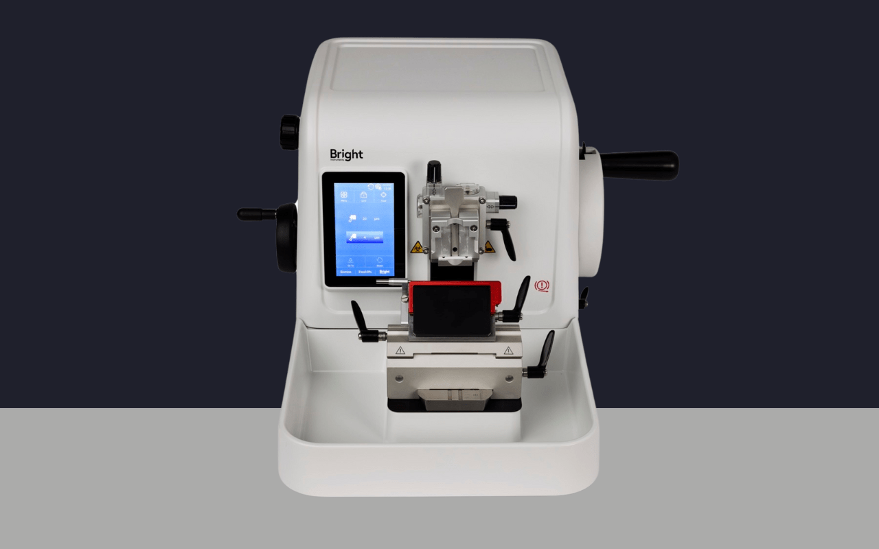 Rotary Microtome 7010 free standing lab equipment full view dark background